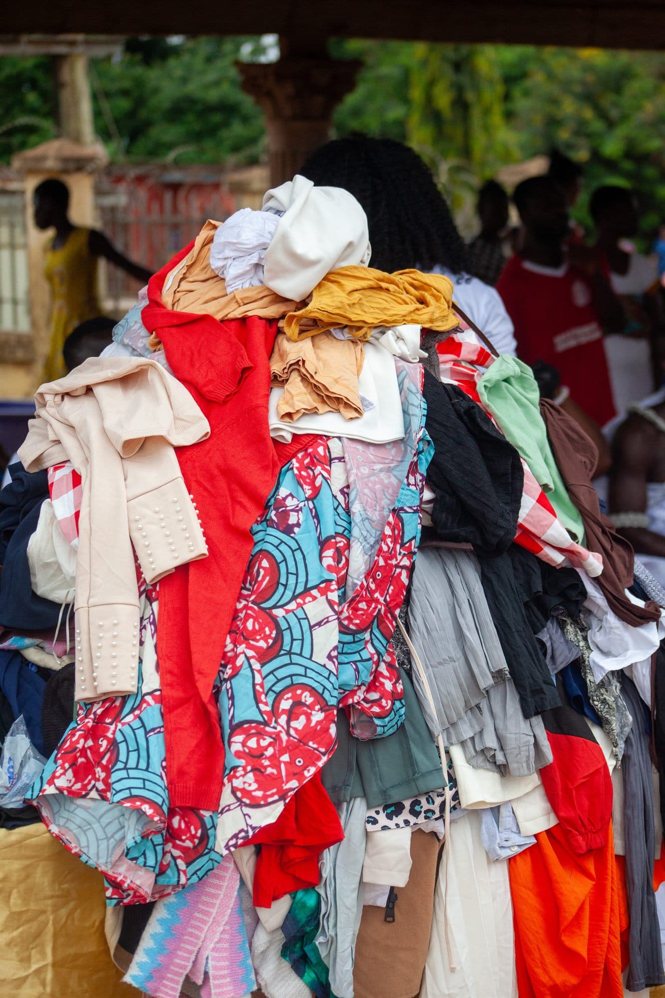 A rack of donated clothes ready to be shared at a community outreach