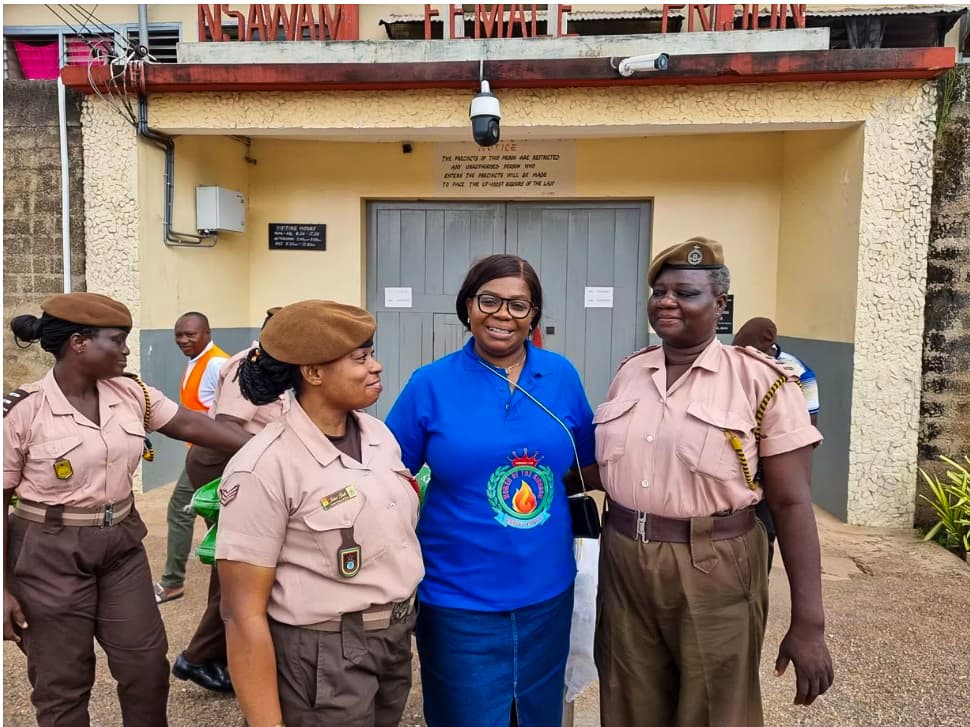 Mrs. Hannah Brock with Ghana Prisons Service officers at Nsawam Female Prison