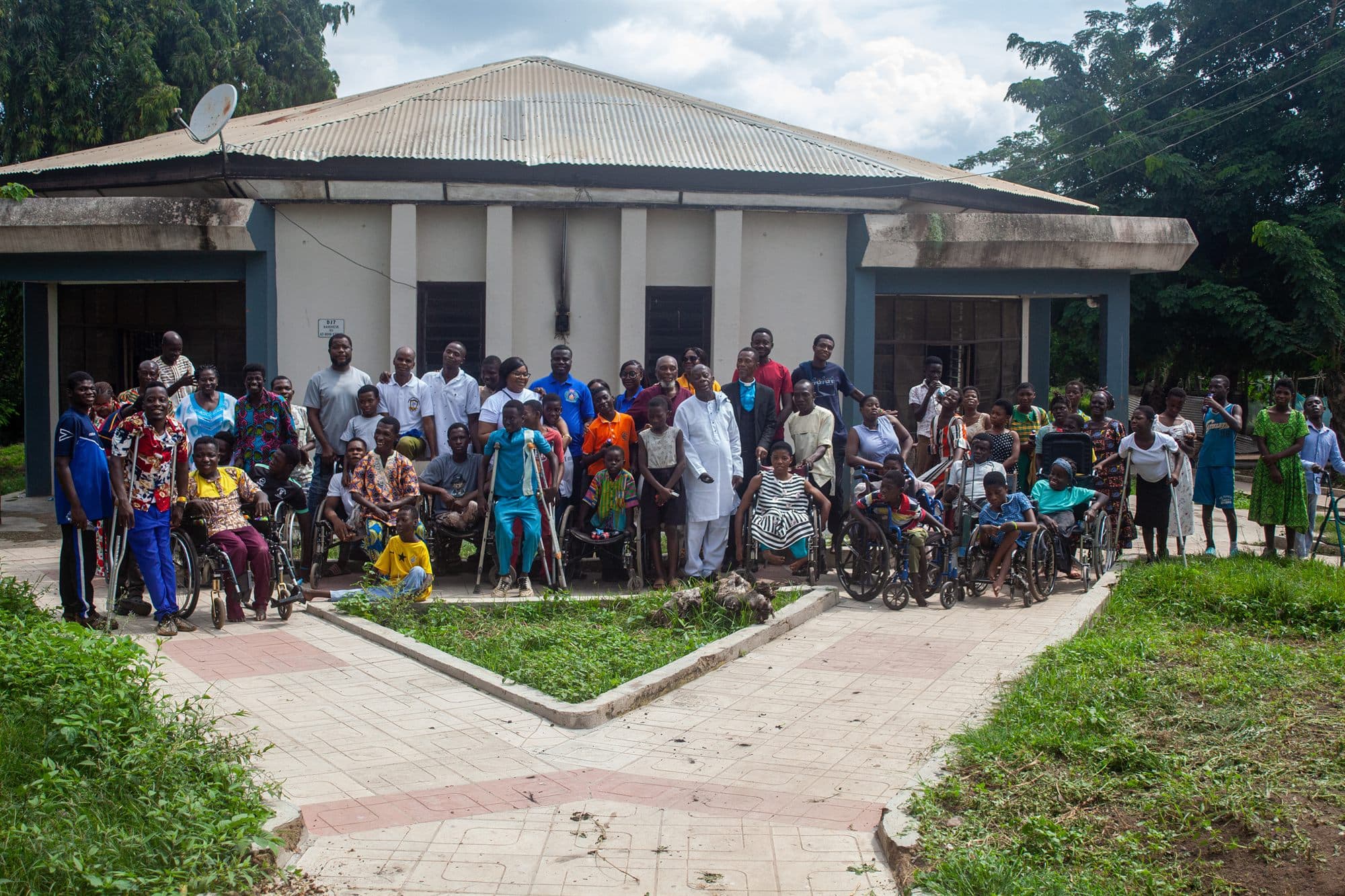 Community members living with disabilities gathered with Women of the Kingdom volunteers at an outreach