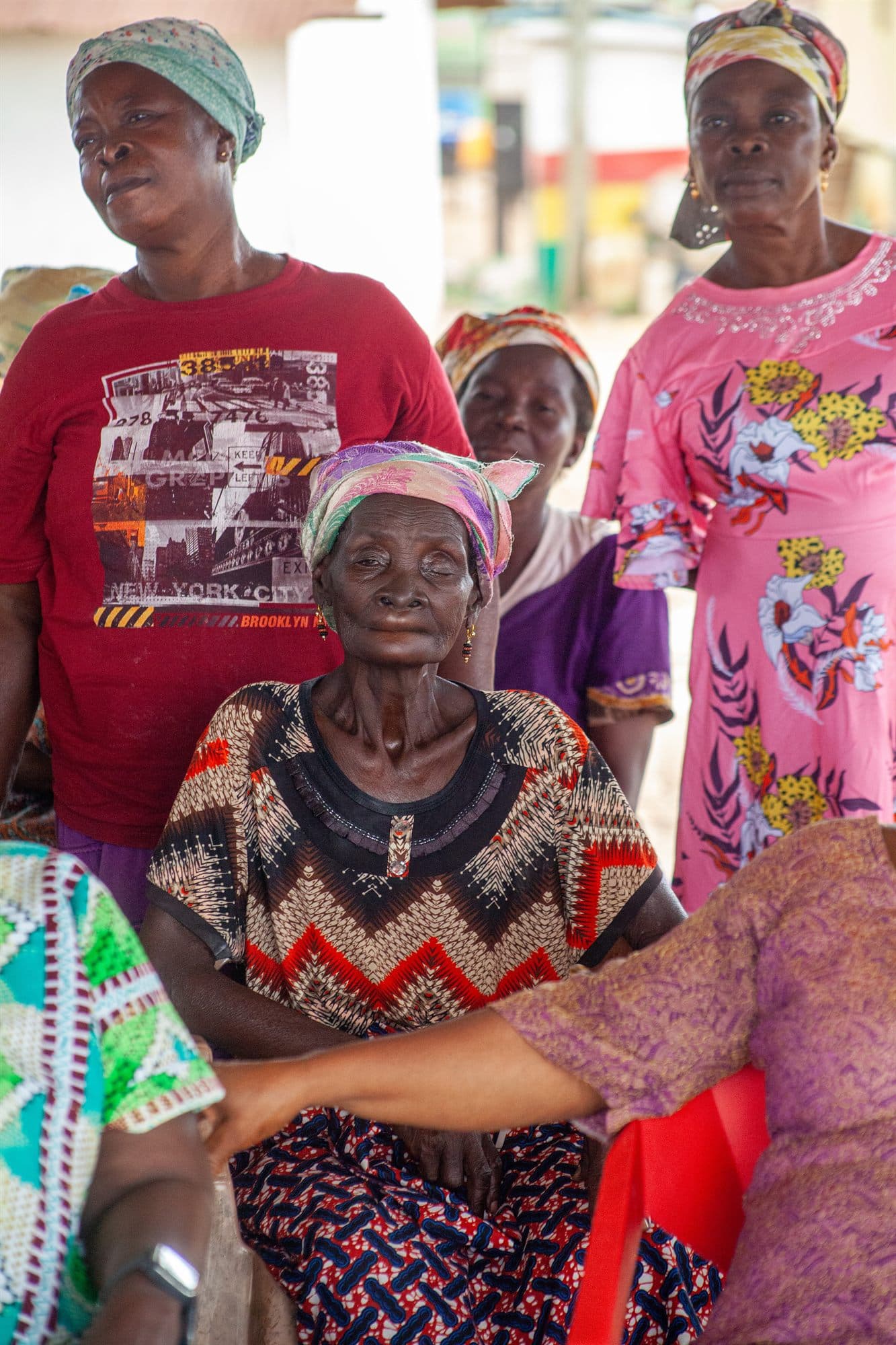 Community elders in colourful dress gathered together