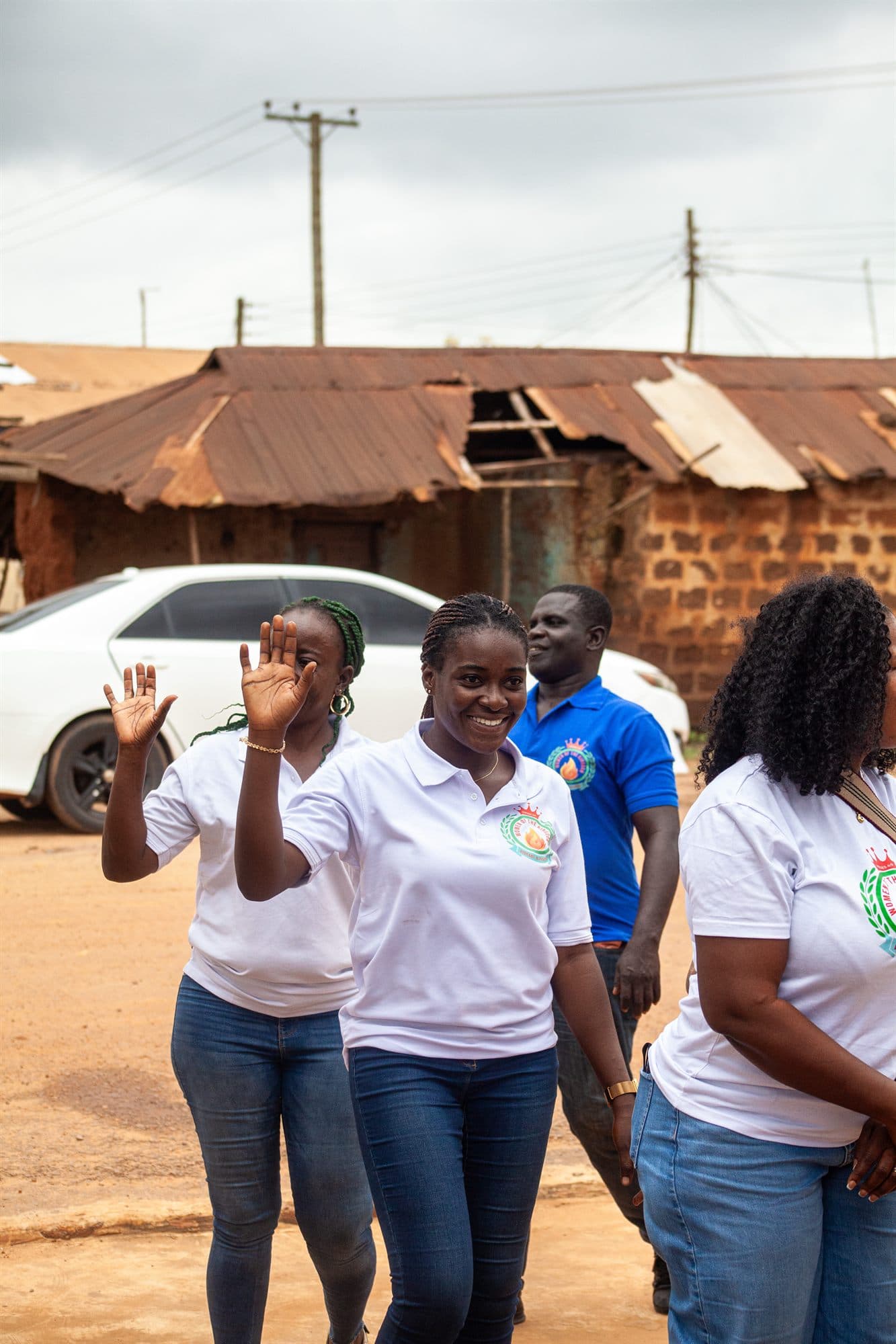 Women of the Kingdom volunteers arriving to greet a village