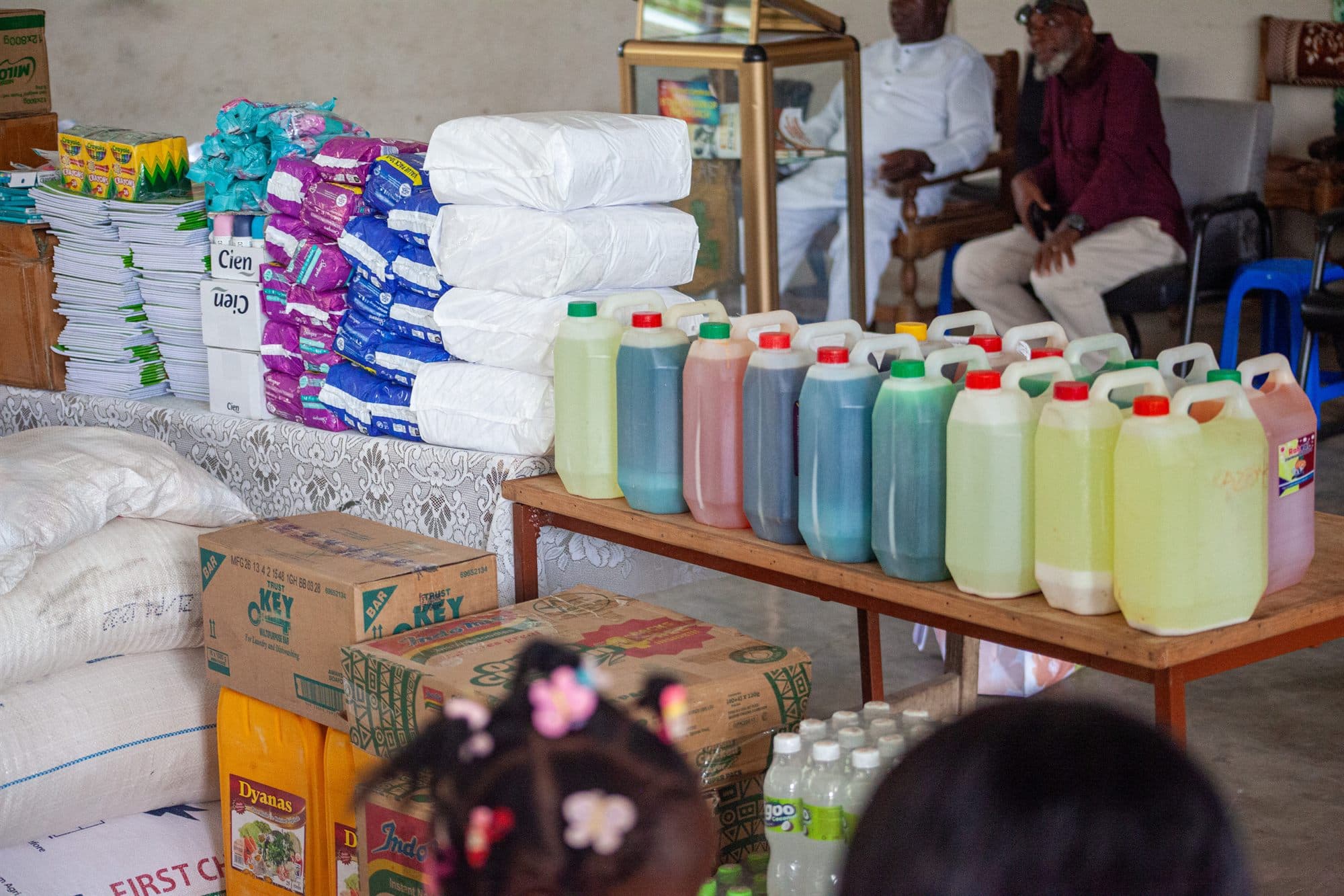 Stacks of donated food, toiletries and household supplies ready for distribution