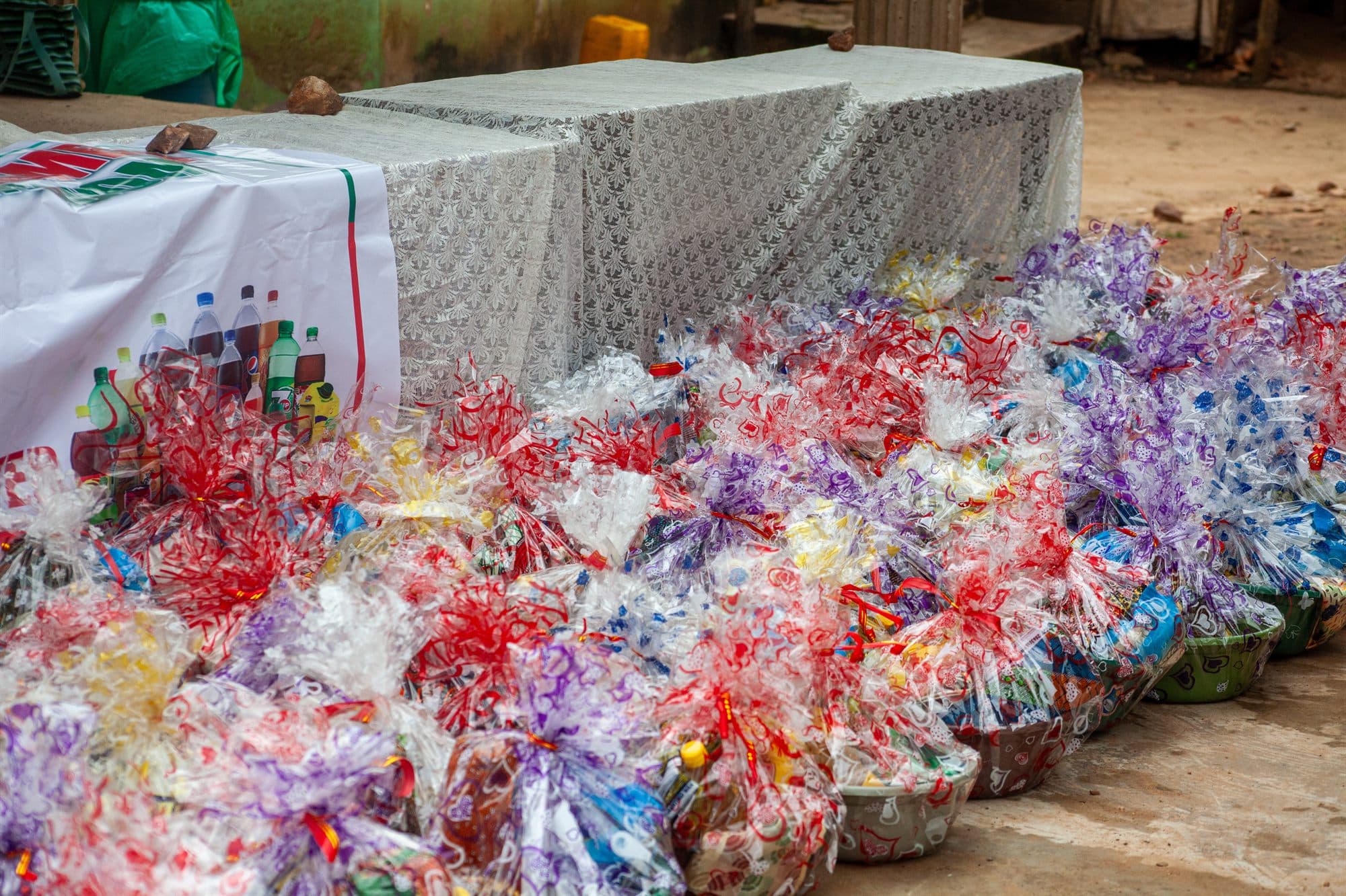 Rows of brightly wrapped gift hampers laid out ready to be shared