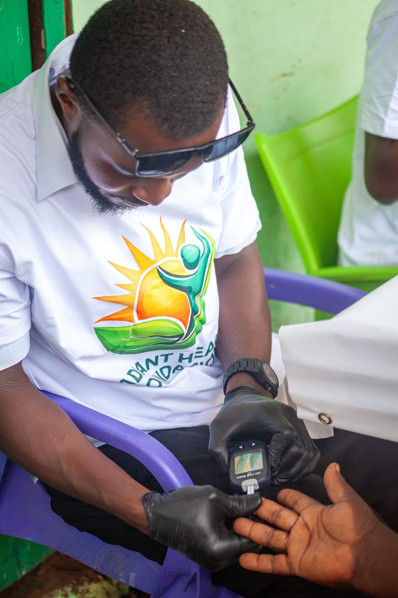 A medic checking a patient during a Women of the Kingdom health screening